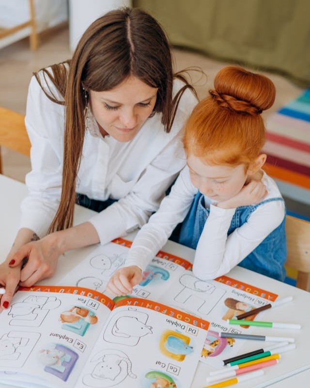 Therapist helping child